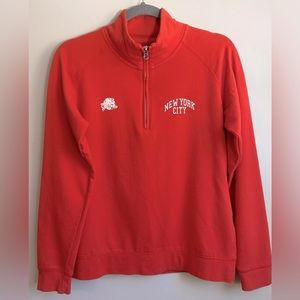 Women’s size medium 1/4 zip Planet Hollywood New York orange sweatshirt.
